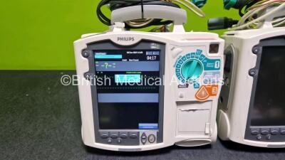 2 x Philips Heartstart MRx Defibrillators (Both Power Up with Stock Module, Stock Module Not Included) Including ECG and Printer Options with 2 x 3 Lead ECG Leads and 2 x Paddle Leads - 2