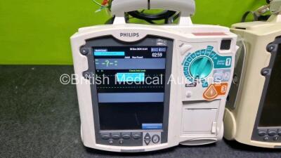 2 x Philips Heartstart MRx Defibrillators (Both Power Up with Stock Module, Stock Module Not Included) Including ECG and Printer Options with 2 x 3 Lead ECG Leads and 2 x Paddle Leads - 2