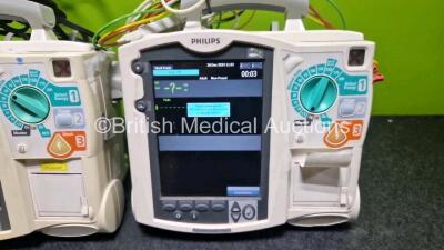 2 x Philips Heartstart MRx Defibrillators (Both Power Up with Stock Module, Stock Module Not Included) Including ECG and Printer Options with 2 x 3 Lead ECG Leads and 2 x Paddle Leads - 3