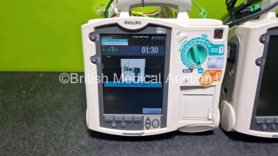 2 x Philips Heartstart MRx Defibrillators (Both Power Up with Stock Module, Stock Module Not Included) Including ECG and Printer Options with 2 x 3 Lead ECG Leads and 1 x Paddle Lead - 2