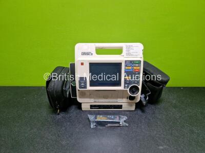 Medtronic Lifepak 12 Biphasic Defibrillator (Powers Up Damage to Casing - See Photos) In Case Including Pacer, ECG and Printer Options with AC Power Adaptor (Powers Up) and Test Load