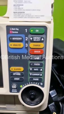 Medtronic Lifepak 12 Biphasic Defibrillator (Powers Up Damage to Casing - See Photos) In Case Including Pacer, ECG and Printer Options with AC Power Adaptor (Powers Up) and Test Load - 3