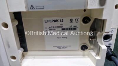 Medtronic Lifepak 12 Biphasic Defibrillator (Powers Up Damage to Casing - See Photos) In Case Including Pacer, ECG and Printer Options with AC Power Adaptor (Powers Up) and Test Load - 8