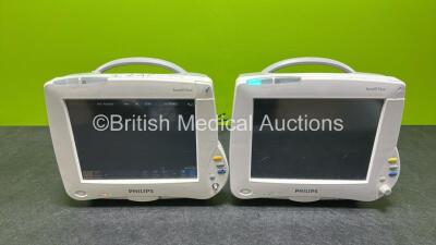 2 x Philips IntelliVue MP30 Patient Monitors Including 2 x Philips M4605A Lithium Batteries (Both Power up, 1 x Damaged Scroller - See Photos)