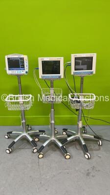 2 x Mindray MEC-1000 Patient Monitors on Stands (Both Draw Power, 1 x Blank Screen) and 1 x Datex-Ohmeda F-FM-00 Patient Monitor on Stand with E-PSMP--00 Multiparameter Module on Stand (Both Power Up) *S/N 6383793 / AQ72B13164 / AQ-127158468*