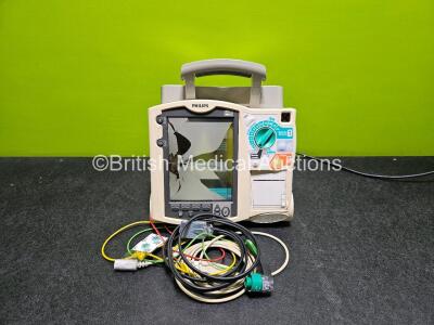 Philips Heartstart MRx Defibrillator (Powers Up, Screen Damaged - See Photo) Including ECG and Printer Options with 1 x Philips M3539A Module, 1 x Philips M3538A Li-Ion Battery AND 3 Lead ECG Lead