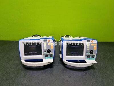 2 x Zoll R Series Plus Defibrillator / Monitors (Both Power Up) Including Pacer, ECG and Printer Options with 2 x Paddle Leads *SN AF13B027339 / AF1B027351*