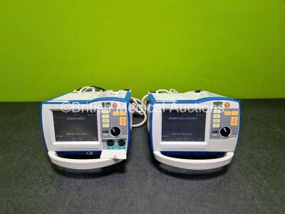 2 x Zoll R Series Plus Defibrillator / Monitors (Both Power Up) Including Pacer, ECG and Printer Options with 2 x Paddle Leads *SN AF12B021006 / AF12B021003*