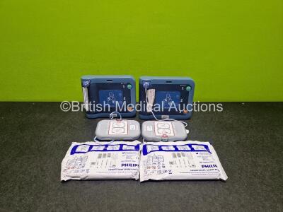 2 x Philips Heartstart FRx Defibrillators (Both Power Up) with 2 x M5070A LiMnO2 Batteries *Install Before 2024 / 2024* and 4 x Smart Pads 2