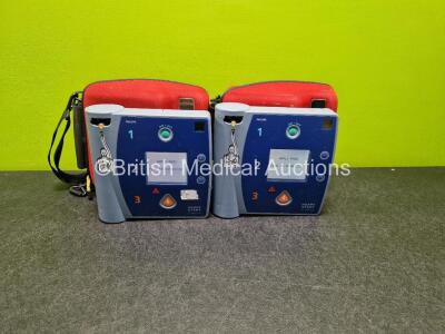 2 x Philips Heartstart FR2+ Defibrillators (Both Power Up) in Case with 2 x LiMnO2 Batteries *Install Before 2023 / 2022* **SN 0202054330 / 0204111323*