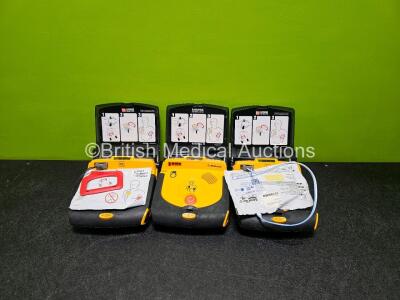 3 x Physio Control Lifepak CR Plus Defibrillators *Mfd - 2016 / 2016 / 2012* (All Power Up) with 1 x Li/S02C12 Battery