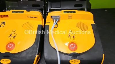 3 x Physio Control Lifepak CR Plus Defibrillators *Mfd - 2016 / 2016 / 2012* (All Power Up) with 1 x Li/S02C12 Battery - 2