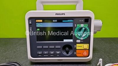 Philips Efficia DFM100 Defibrillator Release Rev 2.00 *Mfd 2021* (Powers Up) Including Pacer, ECG and Printer Options with 1 x Lithium Battery, 1 x Paddle Lead, 1 x 3 Lead ECG Lead and 1 x Power Cord - 4