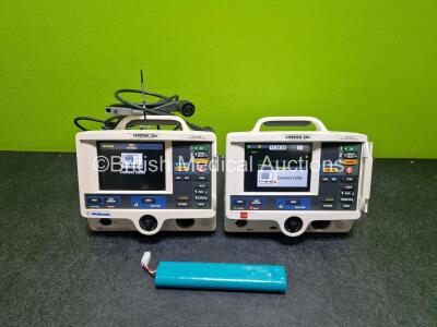 2 x Physio Control Lifepak 20e Defibrillators / Monitors (Both Power Up 1 x Missing Battery Cover) Including Pacer, ECG and Printer Options with 1 x li-ion Batteries and 2 x Paddle Leads