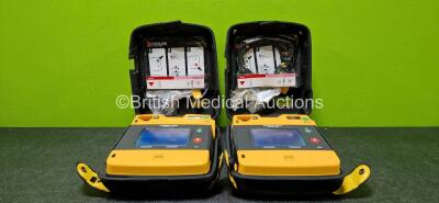 2 x Physio Control Lifepak 1000 Defibrillators (Both Power Up) with 1 x 3 Lead ECG Lead and 1 x Li/MnO2 Battery in Carry Cases *SN 42196468 / 42196480*