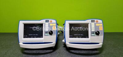 2 x Zoll R Series Plus Defibrillators / Monitors (Both Power Up and Both Missing Batteries - See Photo) Including Pacer, ECG and Printer Options with 2 x Paddle Leads *SN (21)AF15B043767 / (21)AF15B043794*