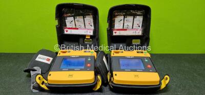 2 x Physio Control Lifepak 1000 Defibrillators (Both Power Up) with 1 x Li/MnO2 Battery in Carry Cases *SN 42196646 / 42196554*