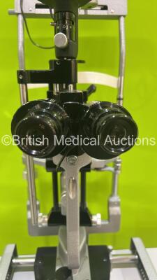 Haag Streit Bern SL900 Slit Lamp with Binoculars, 2 x 10x Eyepieces, 2 x 16x Eyepieces, 1 x 25x Eyepiece and Chin Rest on Hydraulic Table (Powers Up with Good Bulb) *S/N U90022454** - 6