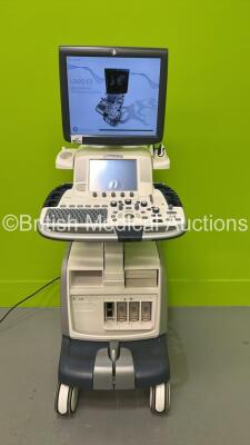 GE Vivid E9 Flat Screen Ultrasound Scanner Model 5205000-4 *S/N 98820US4* **Mfd 2010** Software Version R2.0.4 (Powers Up - Lower Screen Damaged / Missing Rear Lug - See Pictures - Clicking Noise When Turned On ) ***IR223***