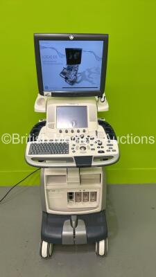 GE Vivid E9 Flat Screen Ultrasound Scanner Model 5205000-4 *S/N 98820US4* **Mfd 2010** Software Version R2.0.4 (Powers Up - Lower Screen Damaged / Missing Rear Lug - See Pictures - Clicking Noise When Turned On ) ***IR223*** - 2