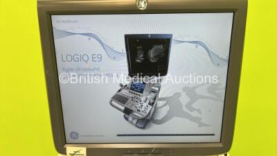 GE Vivid E9 Flat Screen Ultrasound Scanner Model 5205000-4 *S/N 98820US4* **Mfd 2010** Software Version R2.0.4 (Powers Up - Lower Screen Damaged / Missing Rear Lug - See Pictures - Clicking Noise When Turned On ) ***IR223*** - 3