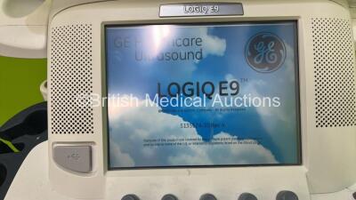 GE Vivid E9 Flat Screen Ultrasound Scanner Model 5205000-4 *S/N 98820US4* **Mfd 2010** Software Version R2.0.4 (Powers Up - Lower Screen Damaged / Missing Rear Lug - See Pictures - Clicking Noise When Turned On ) ***IR223*** - 4