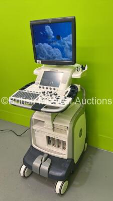 GE Vivid E9 Flat Screen Ultrasound Scanner Model 5205000-4 *S/N 98820US4* **Mfd 2010** Software Version R2.0.4 (Powers Up - Lower Screen Damaged / Missing Rear Lug - See Pictures - Clicking Noise When Turned On ) ***IR223*** - 9