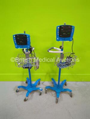 2 x GE Carescape V100 Vital Signs Monitors on Stands (1 x Powers Up, 1 x Draws Power)