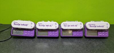 Job Lot Including 4 x Nutricia Flocare Infinity Enteral Feeding Pumps with 1 x Power Supply and 4 x Pole Clamps (All Power Up)