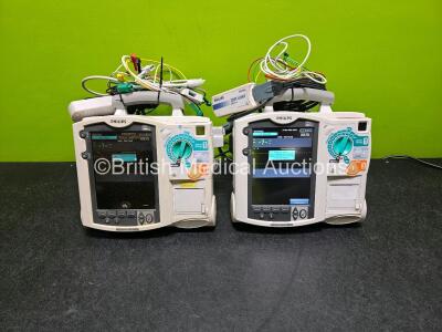 2 x Philips Heartstart MRx Defibrillator (Both Power Up) Including ECG and Printer Options with 2 x Philips M3539A Modules, 2 x Philips M3538A Li-Ion Batteries, 2 x Paddle Lead, 2 x M3725A Test Loads and 2 x 3 Lead ECG Leads