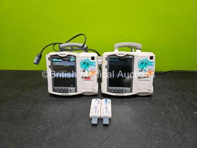 2 x Philips Heartstart MRx Defibrillator (Both Power Up) Including ECG and Printer Options with 2 x Philips M3539A Modules, 2 x Philips M3538A Li-Ion Batteries, 2 x Paddle Lead and 2 x M3725A Test Loads