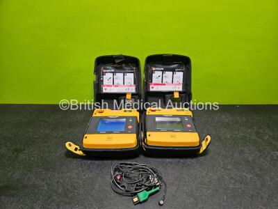 2 x Medtronic Lifepak 1000 Defibrillator *Mfd - 2014 / 2015 * (Both Power Up with Stock Battery Stock Battery Not Included) in Case with 2 x Flat Lithium Batteries *Install Before - 2019 / 2022* and 2 x 3 Lead ECG Leads