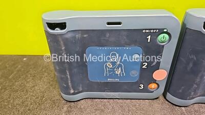 3 x Philips Heartstart FRX Defibrillators (All Power Up) with 3 x LiMNO2 Ref M5070A Batteries *Install Before - 2023 / 2024 / 2017* (1 x Flat) - 2