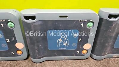 3 x Philips Heartstart FRX Defibrillators (All Power Up) with 3 x LiMNO2 Ref M5070A Batteries *Install Before - 2023 / 2024 / 2017* (1 x Flat) - 3