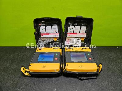 2 x Medtronic Lifepak 1000 Defibrillator *Mfd - 2015 / 2007* (Both Power Up) in Case with 2 x Lithium Batteries *Install Before - 2029 / 2029*