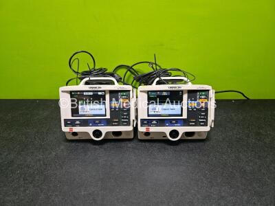 2 x Physio Control Lifepak 20e Defibrillators / Monitors *Mfd - 2019 / 2013* (Both Power Up) Including Pacer ECG and Printer Options with 2 x Paddle Leads and 2 x 3 Lead ECG Leads