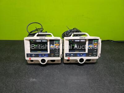 2 x Physio Control Lifepak 20e Defibrillators / Monitors *Mfd - 2018 / 2016* (Both Power Up) Including Pacer ECG and Printer Options with 2 x Paddle Leads, 2 x 3 Lead ECG Leads and 2 x Li-ion Batteries