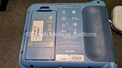 Job Lot Including 1 x Medtronic Physio Control Lifepak 500 with 1 x Li/SO2 Lithium Battery (Powers Up) in Case and 1 x Philips Heartstart FRx Defibrillator (Powers Up) with 1 x M5070A LiMnO2 Battery and 1 x Smart Pads II *Expired* - 6