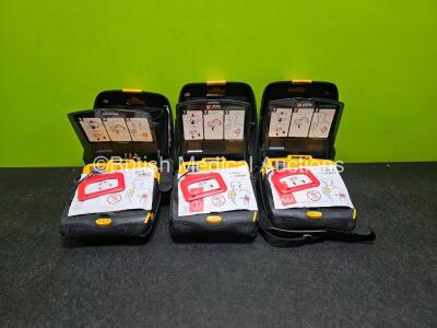 3 x Physio Control Lifepak CR Plus Defibrillators *Mfd - 2016 / 2014 / 2013* (All Power Up) in Case with 3 x Li/SC02CI2 Charge Paks