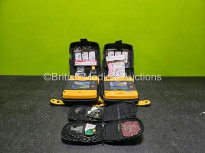 2 x Medtronic Lifepak 1000 Defibrillator (Both Power Up, Both with Faulty Screens - See Photos) in Case with 2 x Lithium Batteries *Install Before - 2024 / 2023* and 2 x 3 Lead ECG Leads