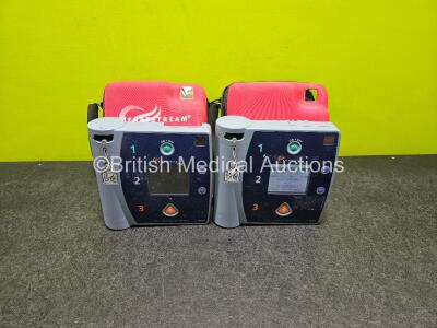 2 x Agilent FR2 Heartstream Defibrillators (Both Power Up) in Case with 1 x LiMNO2 Battery *Install Before - 2018*