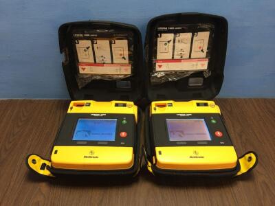 2 x Physio-Control/Medtronic Lifepak 1000 Defibrillators Version 2.51 with Carry Cases,2 x Batteries and 2 x Electrodes (Both Power Up)