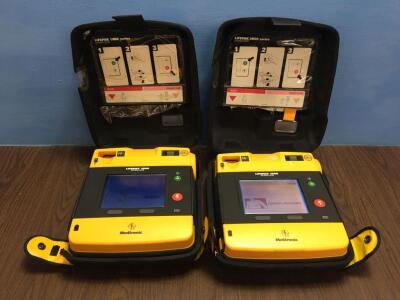 2 x Physio-Control/Medtronic Lifepak 1000 Defibrillators Version 2.51 with Carry Cases,2 x Batteries and 2 x Electrodes (Both Power Up)