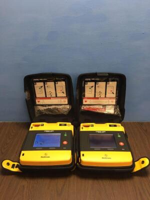 2 x Physio-Control/Medtronic Lifepak 1000 Defibrillators Version 2.51 with Carry Cases,2 x Batteries and 2 x Electrodes (Both Power Up)