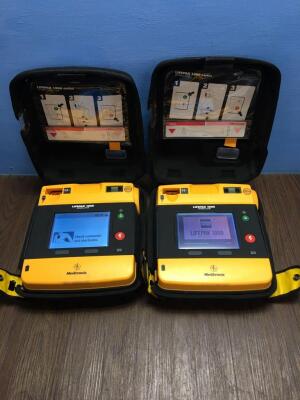 2 x Physio-Control/Medtronic Lifepak 1000 Defibrillators Version 2.51 with Carry Cases,2 x Batteries and 2 x Electrodes (Both Power Up)