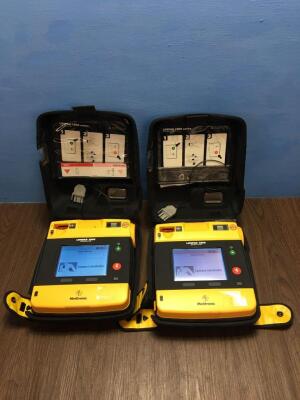 2 x Physio-Control/Medtronic Lifepak 1000 Defibrillators Version 2.51 with Carry Cases,2 x Batteries and 2 x Electrodes (Both Power Up)