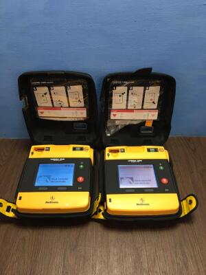 2 x Physio-Control/Medtronic Lifepak 1000 Defibrillators Version 2.51 with Carry Cases,2 x Batteries and 2 x Electrodes (Both Power Up)