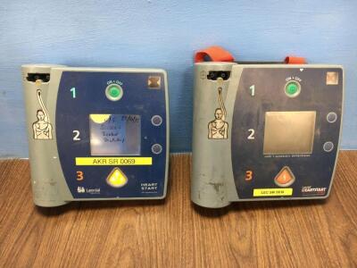 1 x Laerdal Heartstart FR2 and 1 x Laerdal Heartstart FR2+ Defibrillators (Both Power Up with Stock Batteries Not Included / Faulty Displays - Photo)