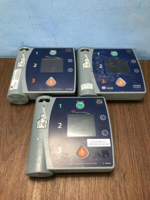 Job Lot Including 2 x Agilent FR2 Defibrillators (Both Power Up, 1 with Damaged Screen-See Photo) 1 x Laerdal Heartstart Defibrillator (Powers Up)