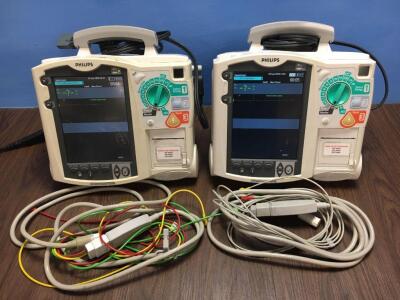 2 x Philips Heartstart MRx Defibrillators Including Pacer, ECG and Printer Options with 2 x Philips M3539A Batteries, 2 x Philips M3538 Module, 2 x Pa